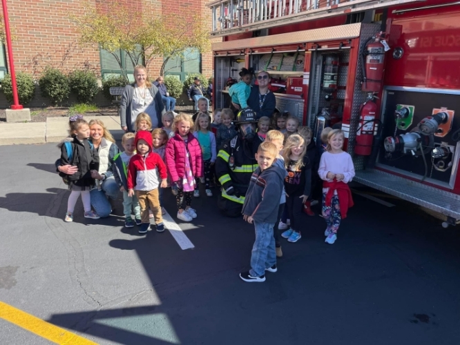 Elementary students with fire truck